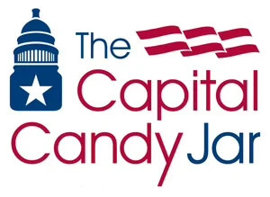 The original Capital Candy Jar logo: a Capitol building icon beside the words 'The Capital Candy Jar' in red and blue, with an American flag motif in the upper right corner. Busy and unfocused.