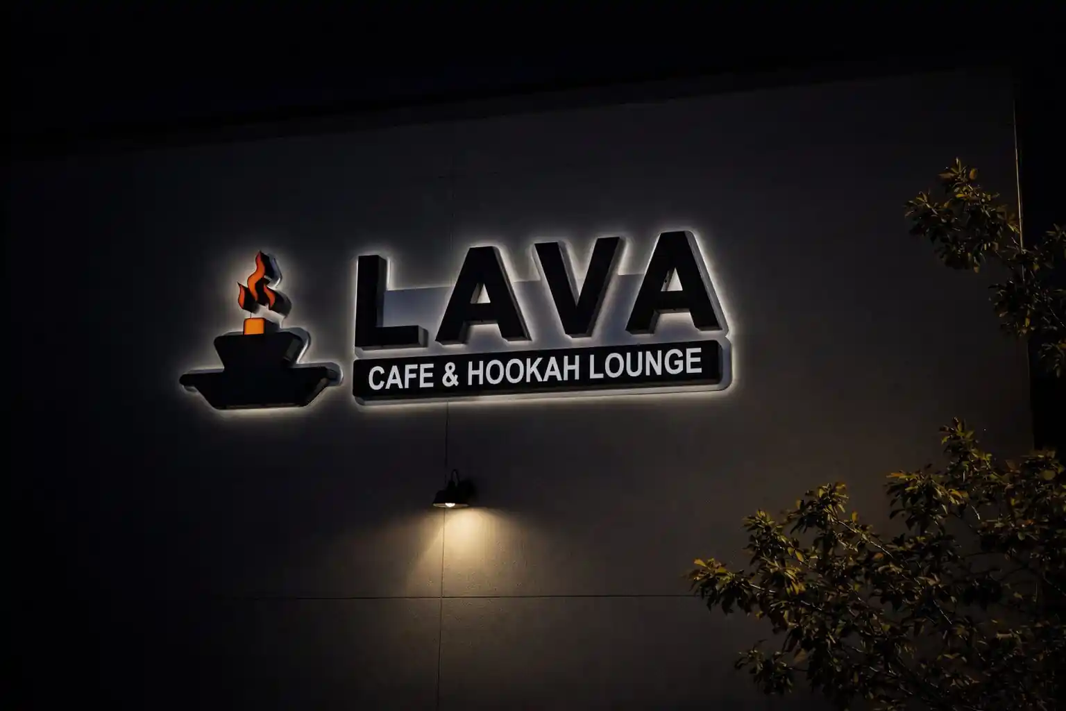 LAVA Cafe and Hookah Lounge illuminated signage at night