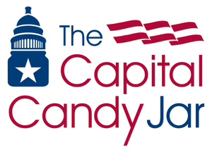 The original Capital Candy Jar logo: a Capitol building icon beside the words 'The Capital Candy Jar' in red and blue, with an American flag motif in the upper right corner. Busy and unfocused.